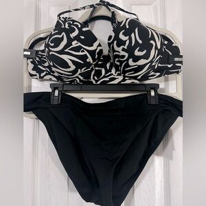 Black and white bikini top with solid black bottoms.
